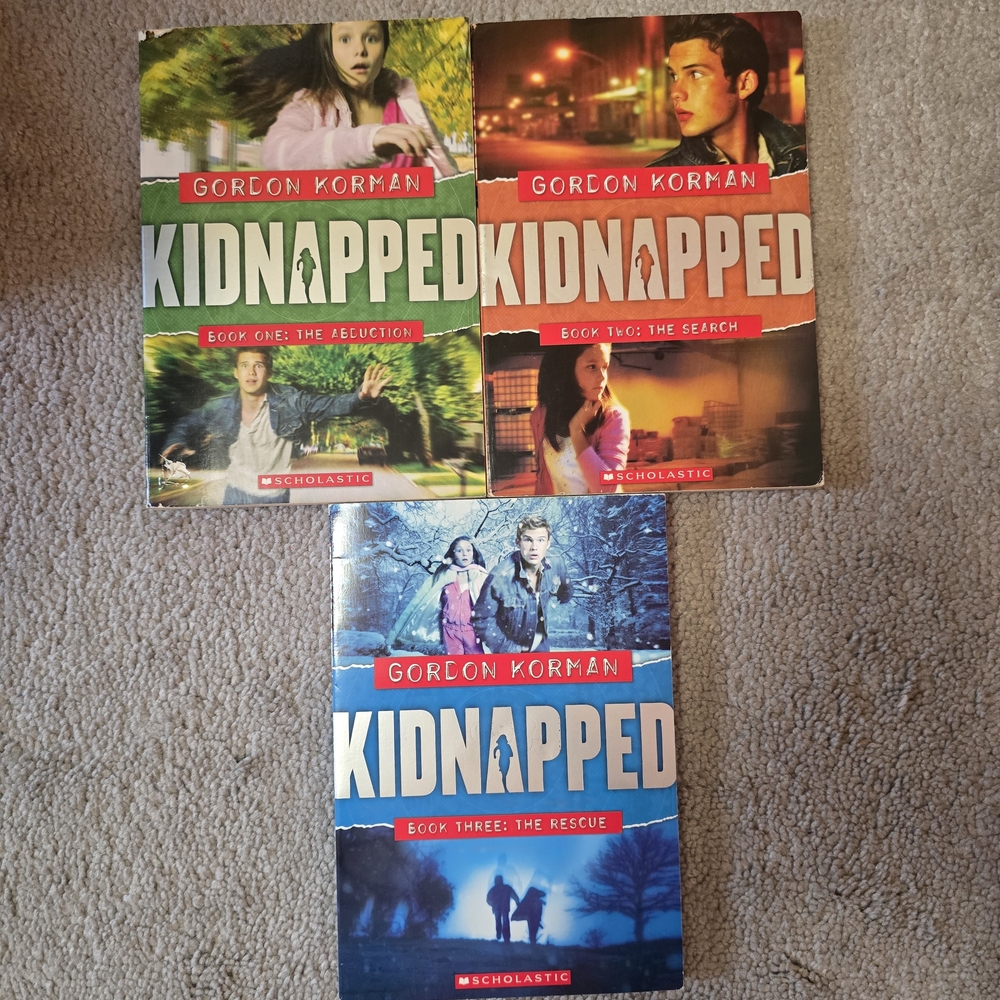 Scholastic Kidnapped Series by Gordon Korman - Red and Blue Covers